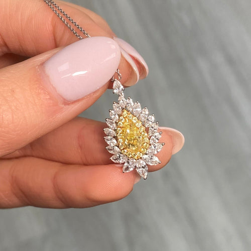 Intense yellow pear shape. Gia certified intense yellow diamond. Yellow diamond necklace. Unique yellow diamond necklace. Yellow diamond pear shape necklace.