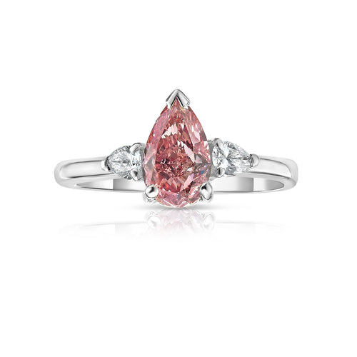 1.01 Carats Center Fancy Intense Pink GIA Certified Diamond Pear Shape Diamond 0.21 Carat Side Diamonds SI2 Clarity Very Good and Good Cutting Strong Blue Fluorescence.