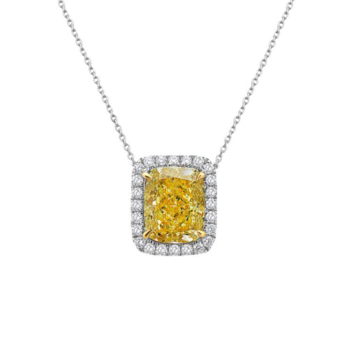 Natural fancy light yellow cushion cut diamond in a white diamond halo on a 18k gold pendant.
