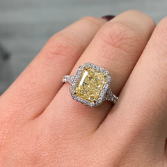 Old money yellow diamond ring with White Halo diamonds with a VS2 clarity.
