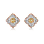 Light yellow and fancy light yellow diamond studs, in a flower theme with 1.5 carats of surrounding white and yellow diamonds.