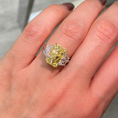 GIA certified fancy yellow elongated radiant diamond engagement ring with a striking center with a VVS2 clarity.