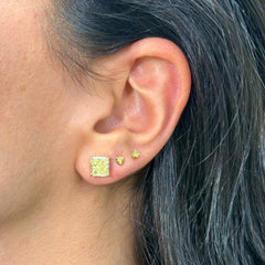 2 Carat each fancy light yellow studs earrings set in 18 karat yellow gold.Fancy light yellow diamond earrings. Yellow diamond earrings. Canary diamond earrings