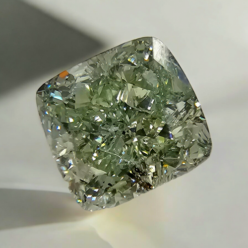 GIA certified natural intense yellowish green cushion cut diamond SI1 clarity.