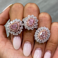 Fancy natural light pink elongated cushion cut set in white diamond white gold ring.