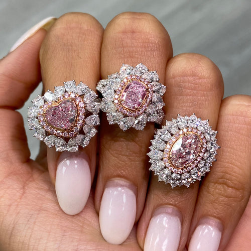 Fancy natural light pink elongated cushion cut set in white diamond white gold ring.
