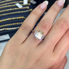 Light yellow emerald-cut diamond ring with excellent cut, VS2 clarity, and GIA certification.