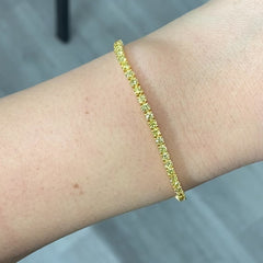 Fancy round shaped intense yellow diamond tennis bracelet, GIA certified with VS clarity.