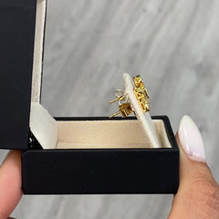 Celebrity style unique earrings with pear, radiant, and oval cut diamonds.