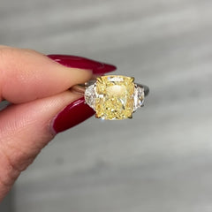 Fancy yellow cushion diamond engagement ring featuring a GIA certified cushion cut diamond.