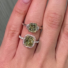 GIA certified greenish yellow cushion diamond in a pink halo engagement ring with VS1 clarity.