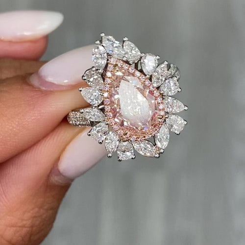 Unique peach color diamond ring, pear shaped, GIA certified.