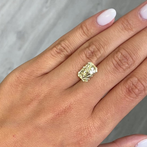 Fancy yellow elongated radiant diamond with VVS2 clarity and excellent cut.