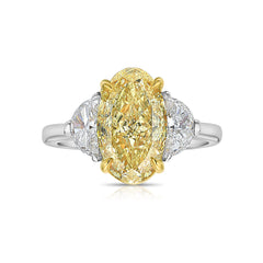 3ct Fancy intense Yellow Oval Three Stone Diamond Ring, a canary oval diamond.