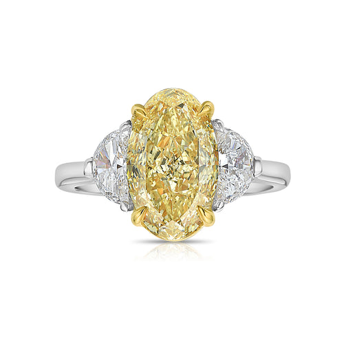 3ct Fancy intense Yellow Oval Three Stone Diamond Ring, a canary oval diamond.