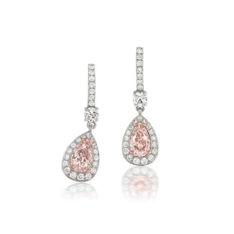 Ethereal natural light pink oval shaped elongated diamond earrings.