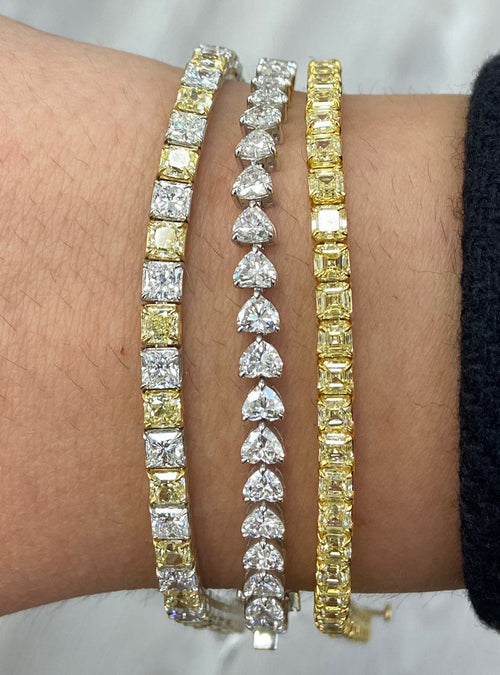Alternating yellow and white diamond bracelet. tennis bracelet. alternating diamond bracelet. yellow diamond cushions.