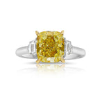 Yellow cushion-cut diamond ring with VS1 clarity, GIA certified, set in an elegant design.