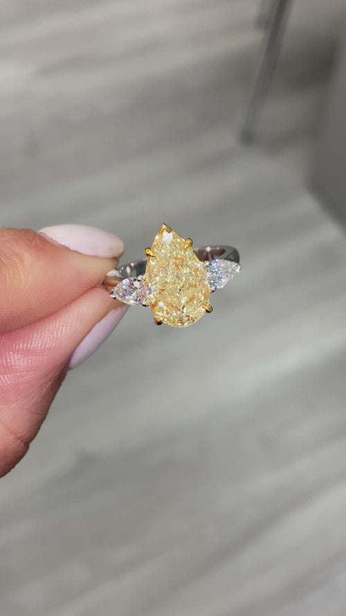 yellow diamond ring. yellow diamond pear shape. yellow diamonds. fancy yellow pear shape.
