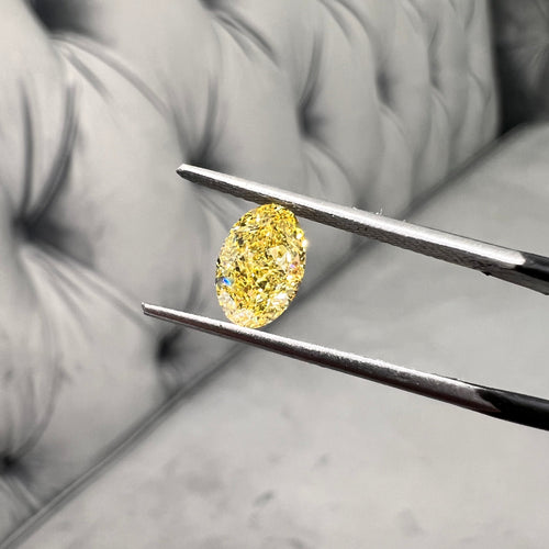 Fancy intense yellow oval shape. Fancy intense yellow. Oval yellow diamond.