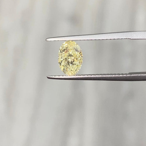 canary yellow diamond, fancy light yellow diamond, oval cut diamond, oval yellow diamond