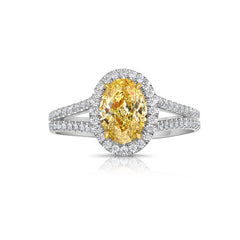 Old money fancy intense natural yellow oval diamond ring.