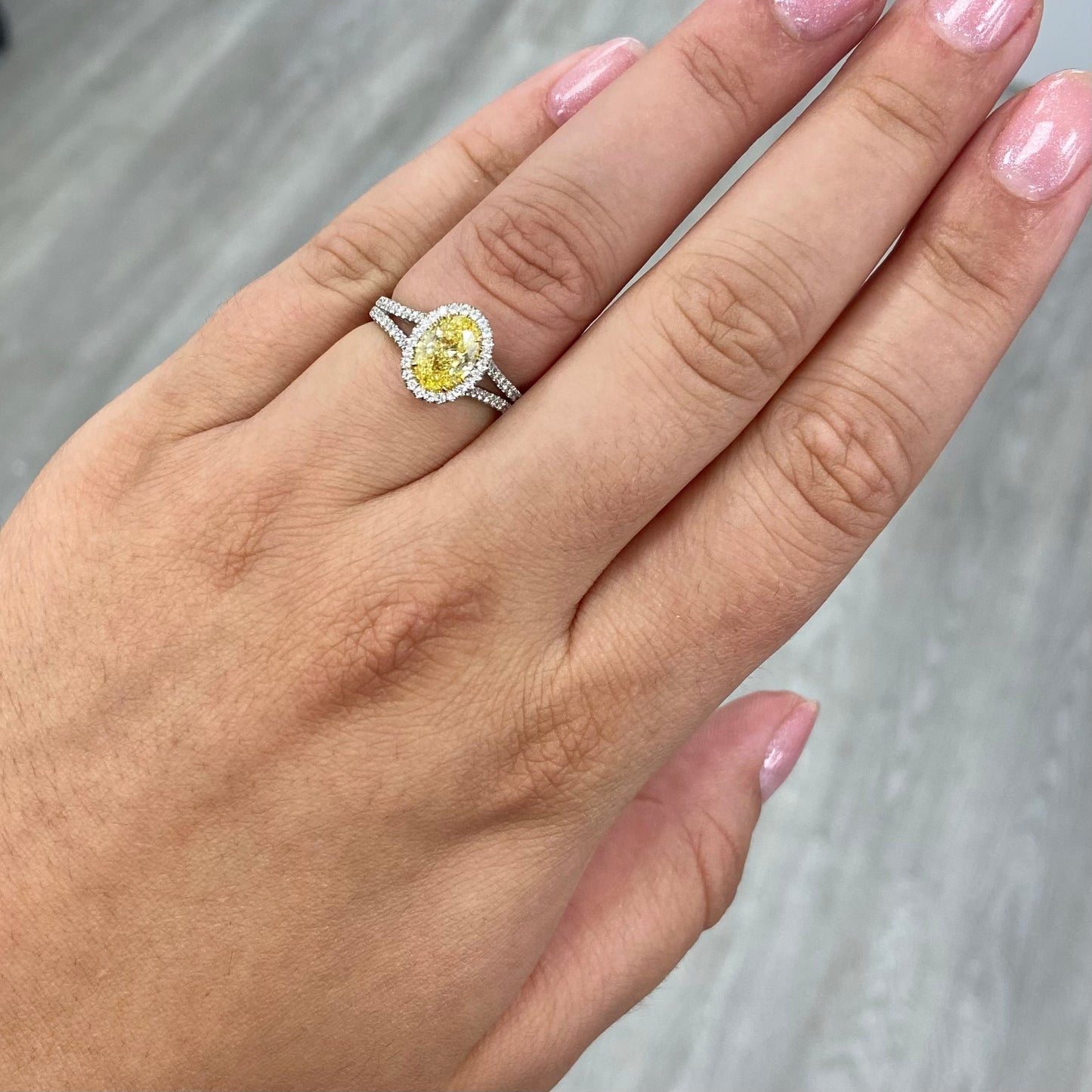 Fancy intense yellow oval diamond ring