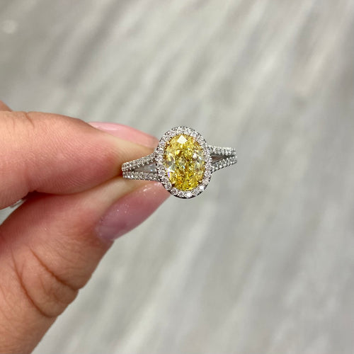 Fancy intense yellow oval diamond ring