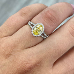 Fancy intense yellow oval diamond ring