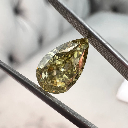 Chameleon diamond. Chameleon green diamond. GIA green diamond. Green diamond pear shape. Affordable green diamond.