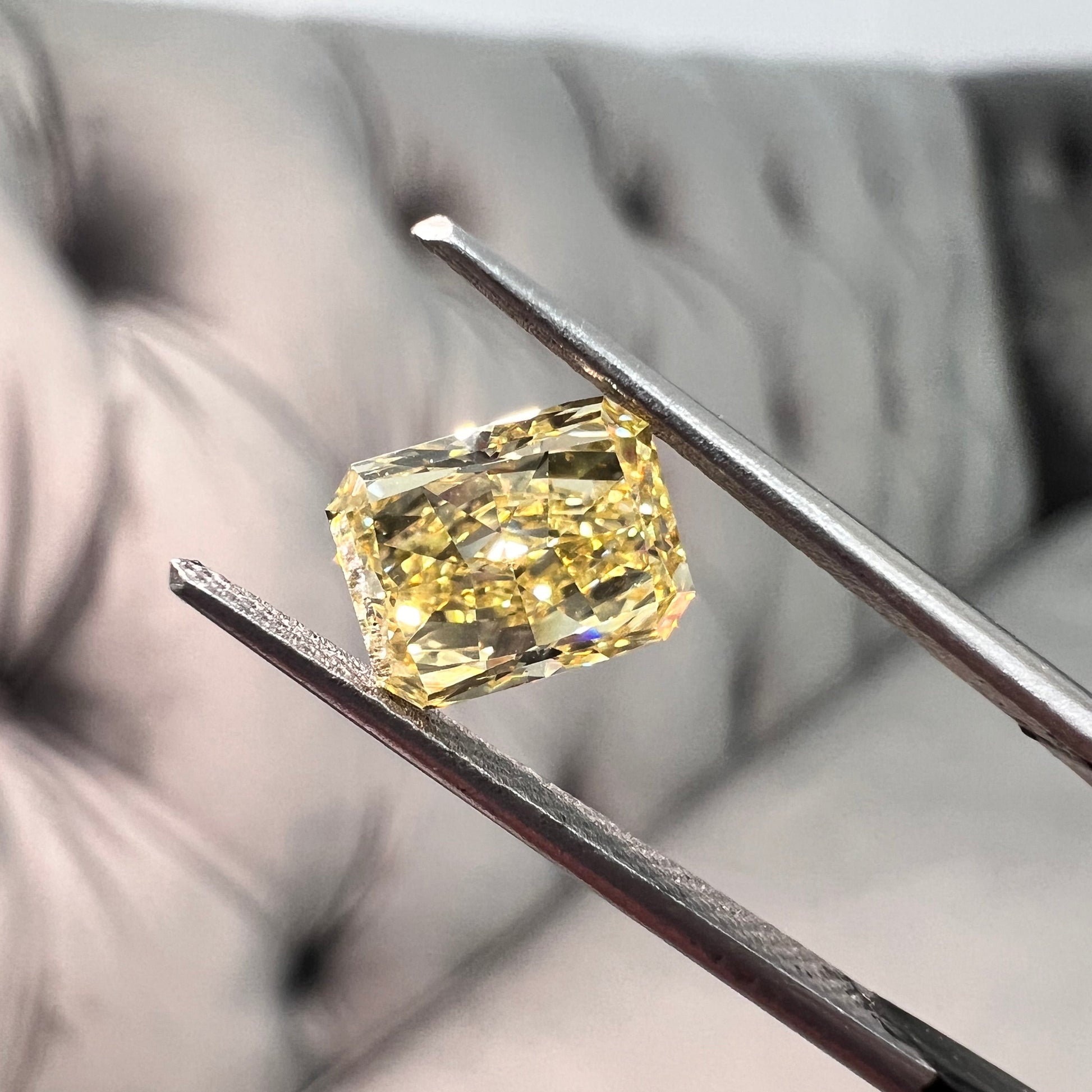 Elongated fancy intense yellow diamond radiant cut. Long yellow diamond radiant cut. Long radiant diamond.