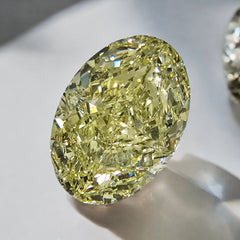 Fancy radiant yellow VS2 oval cut diamond, GIA certified.