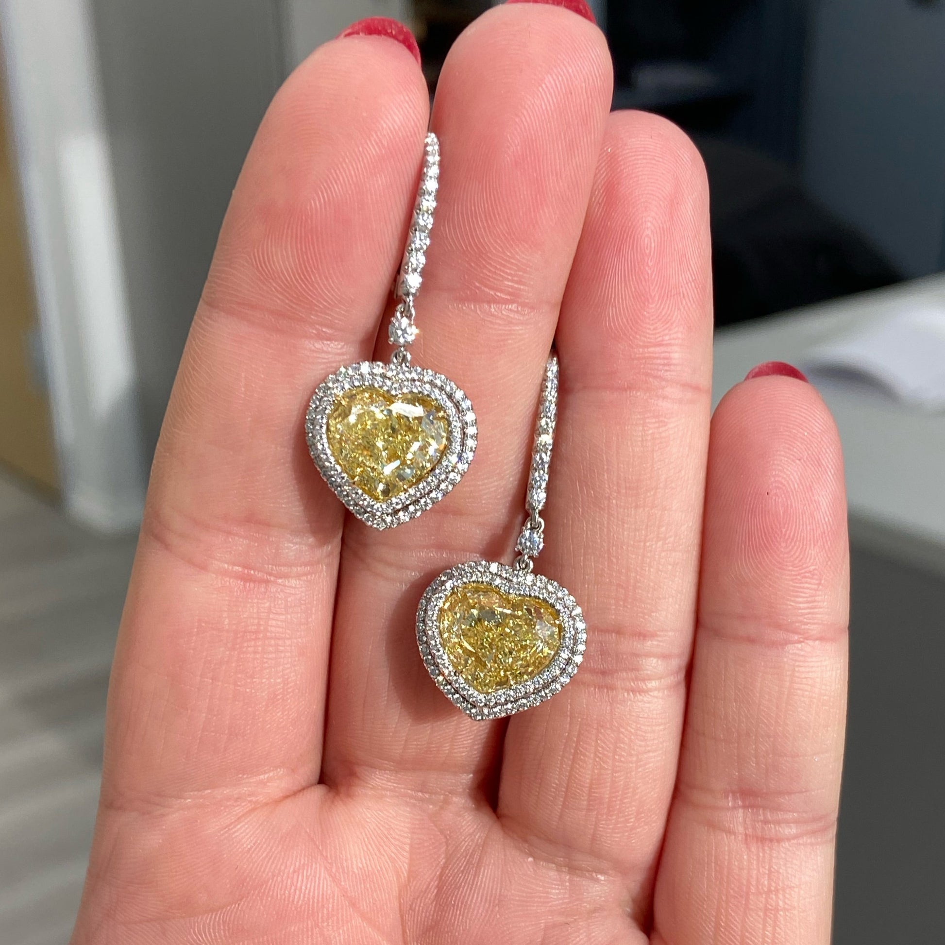 Red carpet yellow diamond earrings. Yellow heart diamond earrings. 10 carat yellow diamond earrings. Yellow diamond drop earrings. Diamond drop earrings. Luxury diamond earrings.