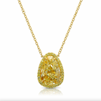 Old money light yellow pear-shaped diamond pendant, accented by a radiant halo of yellow diamonds with SI1 clarity.