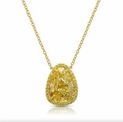 Old money light yellow pear-shaped diamond pendant, accented by a radiant halo of yellow diamonds with SI1 clarity.