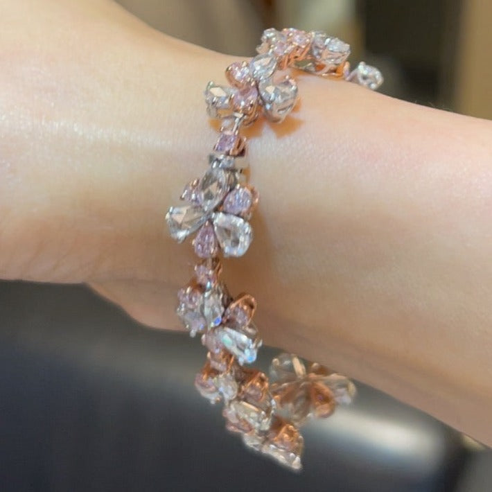 rare colors. pink diamond bracelet. pink floral bracelet. pink pear shape diamond. pink and white diamond bracelet. Natural pink diamond jewelry.