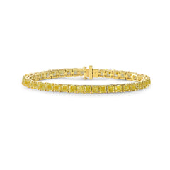 Elegant fancy yellow cushion cut diamond tennis bracelet featuring VS-VVS clarity.