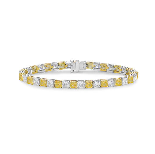 Alternating yellow and white diamond bracelet. tennis bracelet. alternating diamond bracelet. yellow diamond cushions.
