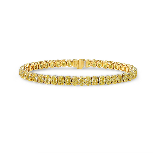 Old money yellow oval tennis bracelet. yellow oval diamond bracelet. oval diamonds.