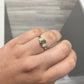 Color changing diamond, chameleon diamond, green diamond, J-Lo green diamond, three stone ring, unique engagement ring