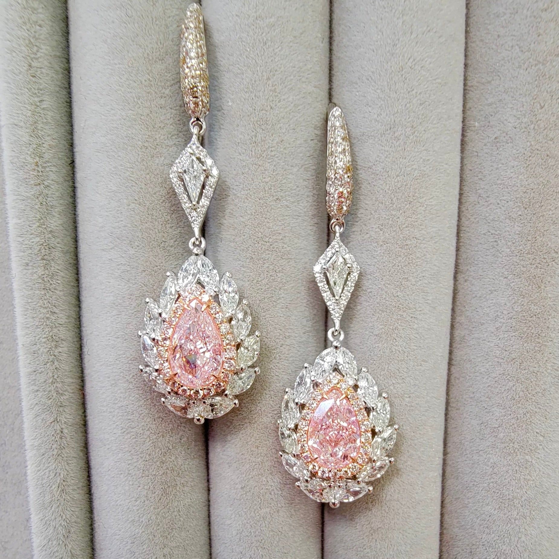 pink diamond earrings. pink diamonds. pink diamond jewelry. pink diamond studs. pink diamond drop earrings. pink and white diamond earrings. pink diamond pear shaoes.