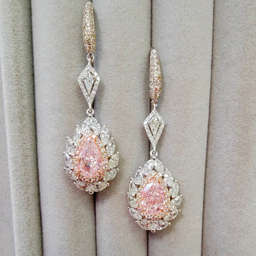 pink diamond earrings. pink diamonds. pink diamond jewelry. pink diamond studs. pink diamond drop earrings. pink and white diamond earrings. pink diamond pear shaoes.