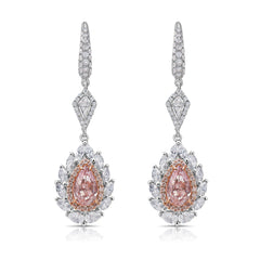 Ethereal pink diamond earrings. pink diamonds. pink diamond jewelry. pink diamond studs. pink diamond drop earrings. pink and white diamond earrings. pink diamond pear shapes.