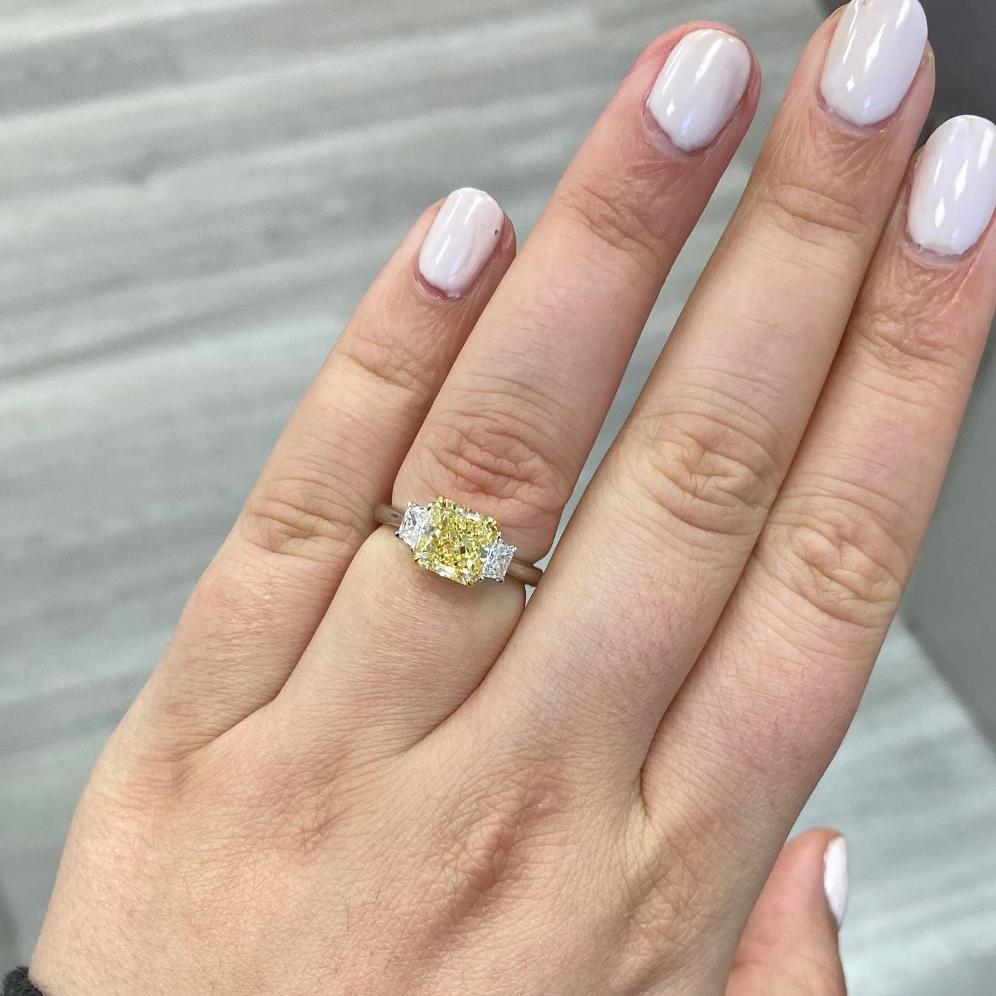 fancy yellow diamond ring. yellow diamonds. fancy yellow diamond. 3 stone ring. 2 carat yellow diamond.
