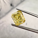 Fancy intense yellow elongated radiant. Long yellow radiant cut. Elongated radiant yellow diamond. Long radiant diamond.