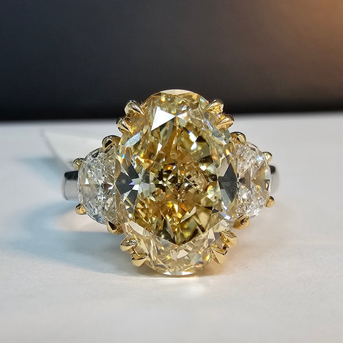 4.47 Carat Center Diamond GIA Certified Fancy Brownish Yellow Oval Cut Center Diamond Internally Flawless (IF) Clarity 0.70 Carat Half Moon Side Diamonds Set in 18k & Platinum Handmade in NYC