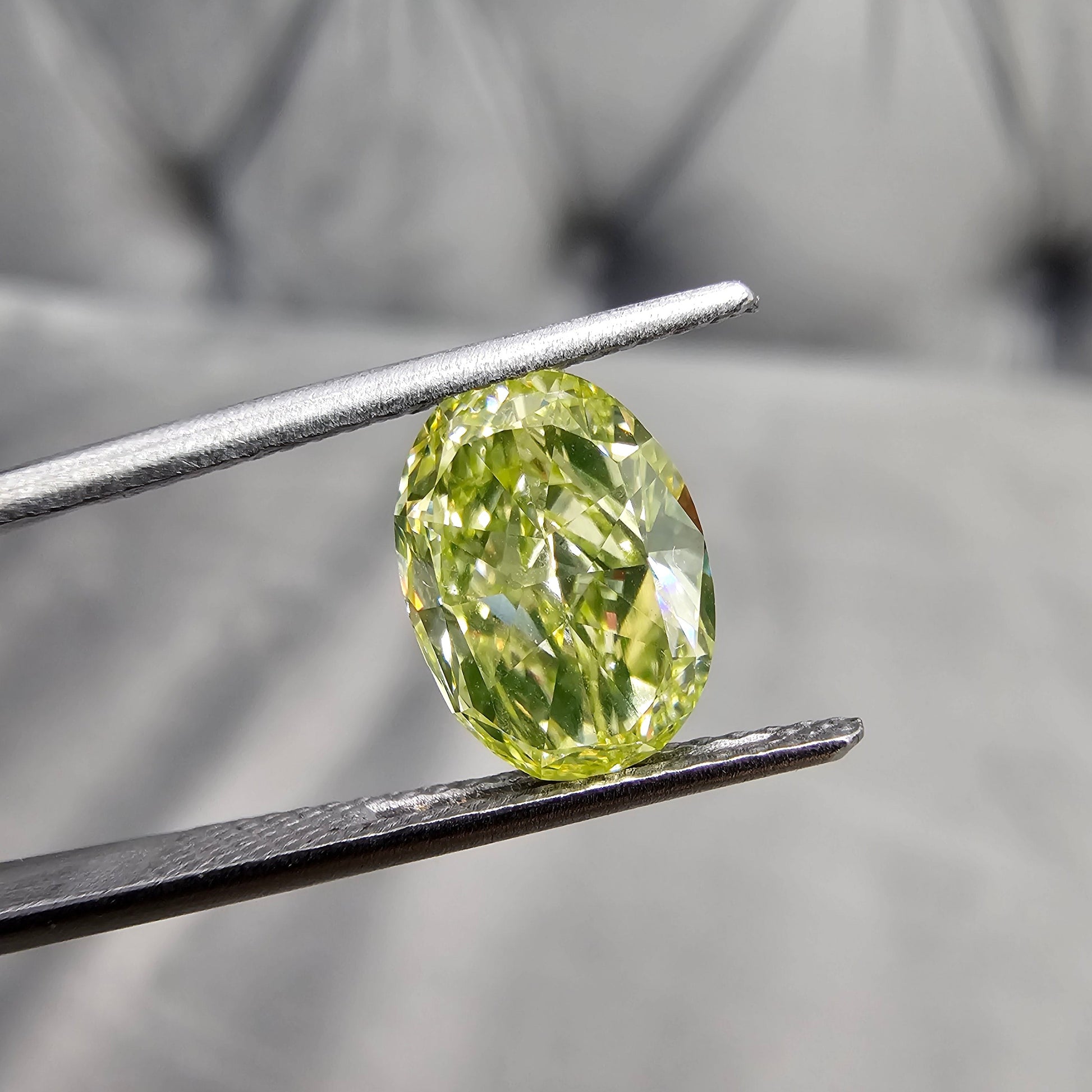2.43 Carats Total Fancy Intense Green-Yellow Oval Diamond VS1 Clarity " Strong Green Fluorescence" Giving it the desired NEON green color  GIA Certified Diamond 