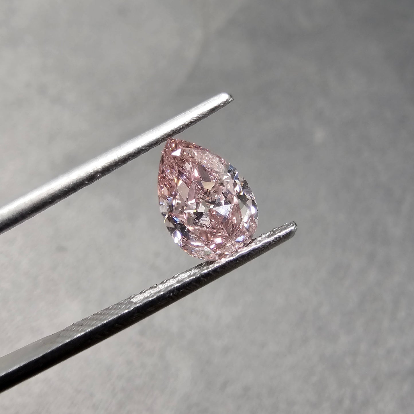 1.02 Carats Total  Fancy Pink  GIA Certified Diamond  Pear Shape Diamond SI2 Clarity  Medium Blue Fluorescence Has the measurements of 1.5 Carat Diamond 
