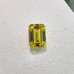 Radiant yellow emerald cut diamond, GIA certified.