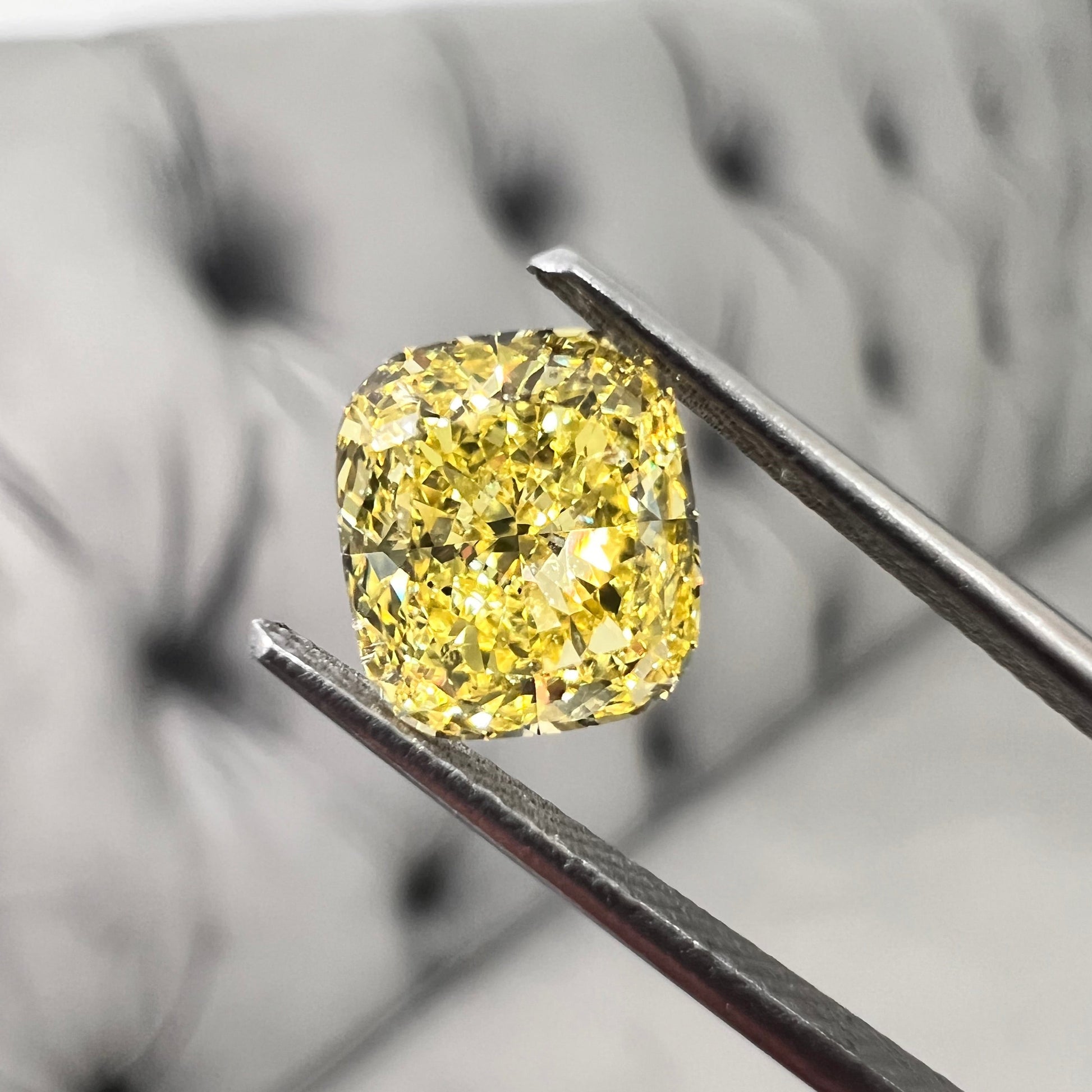 Fancy intense yellow diamond. GIA intense yellow. GIA cushion cut. Canary yellow bright cushion cut.